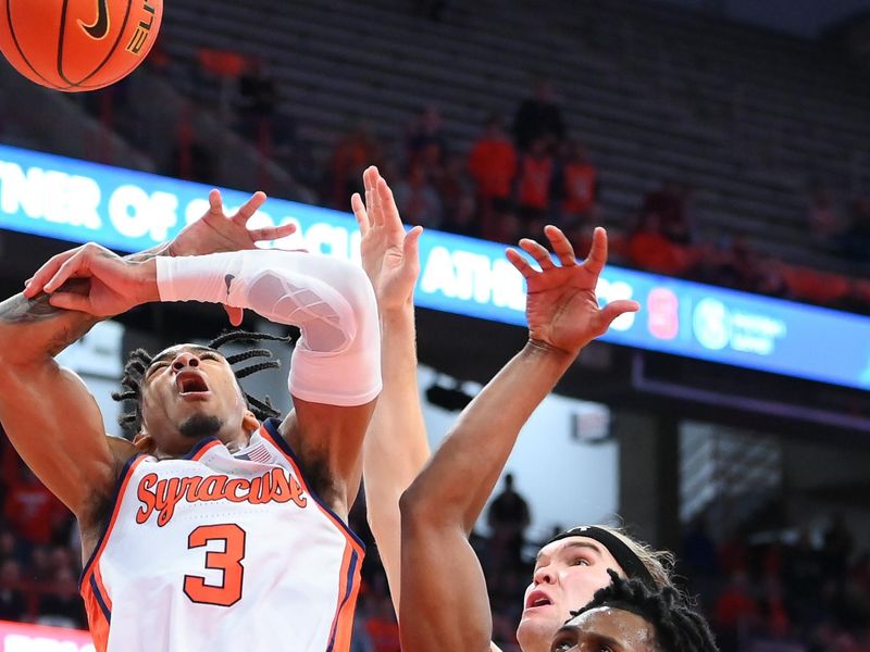 Nov 14, 2023; Syracuse, New York, USA; Syracuse Orange guard Judah Mintz (3) and Colgate Raiders guard Nicolas Louis-Jacques (5) battle for a loose ball during the second half at the JMA Wireless Dome. Mandatory Credit: Rich Barnes-USA TODAY Sports