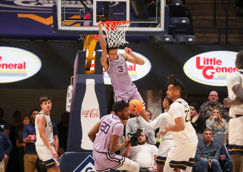 Jan 9, 2024; Morgantown, West Virginia, USA; Kansas State Wildcats guard Dorian Finister (3) dunks the ball during the second half against the West Virginia Mountaineers at WVU Coliseum. Mandatory Credit: Ben Queen-USA TODAY Sports