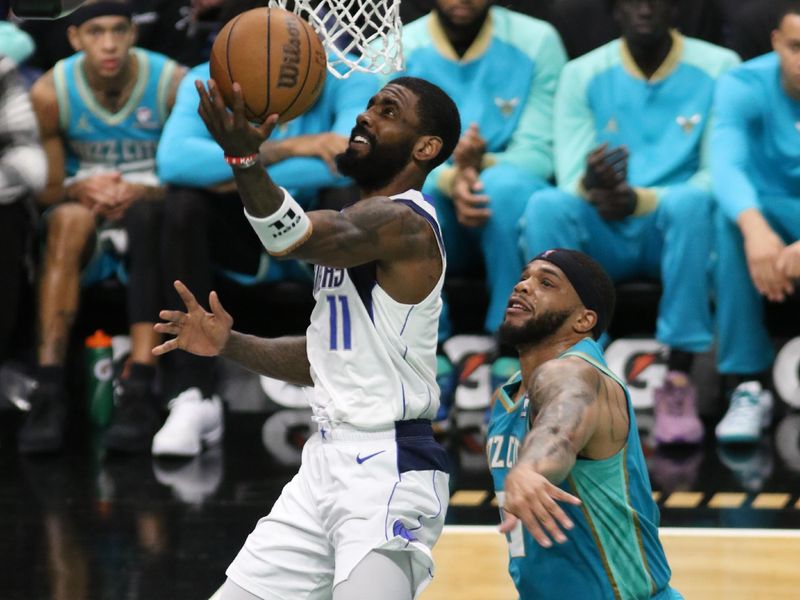 CHARLOTTE, NC - APRIL 9: Kyrie Irving #11 of the Dallas Mavericks shoots the ball during the game against the Charlotte Hornets on April 9, 2024 at Spectrum Center in Charlotte, North Carolina. NOTE TO USER: User expressly acknowledges and agrees that, by downloading and or using this photograph, User is consenting to the terms and conditions of the Getty Images License Agreement. Mandatory Copyright Notice: Copyright 2024 NBAE (Photo by Brock Williams-Smith/NBAE via Getty Images)