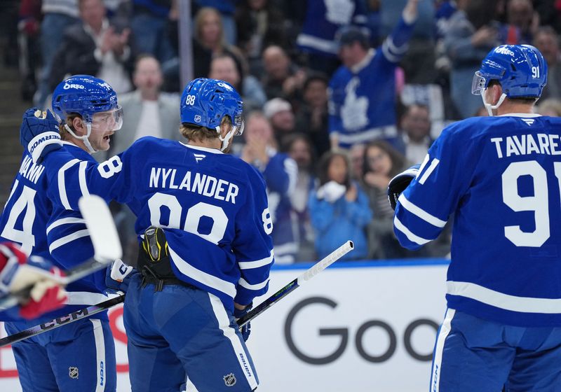 Oct 8, 2025; Toronto, Ontario, CAN; Toronto Maple Leafs center Bobby McMann (74) scores a goal and celebrates with right wing William Nylander (88) against the Montreal Canadiens  during the first period at Scotiabank Arena. Mandatory Credit: Nick Turchiaro-Imagn Images