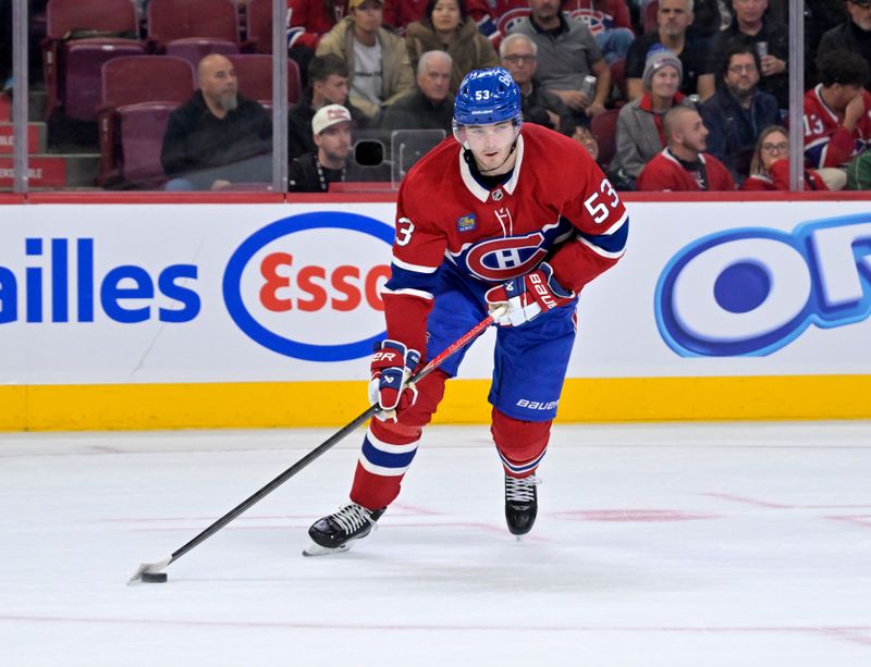 Oct 18, 2025; Montreal, Quebec, CAN; Montreal Canadiens defenseman Noah Dobson (53) plays the puck during the third period of the game against the New York Rangers at the Bell Centre. Mandatory Credit: Eric Bolte-Imagn Images