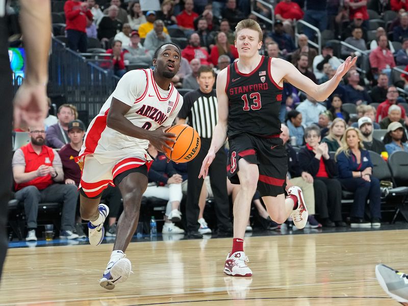 Mar 9, 2023; Las Vegas, NV, USA; Arizona Wildcats guard Courtney Ramey (0) looks to shoot ahead of Stanford Cardinal guard Michael Jones (13) during the second half at T-Mobile Arena. Mandatory Credit: Stephen R. Sylvanie-USA TODAY Sports