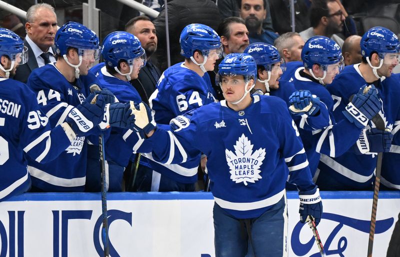 Jan 16, 2025; Toronto, Ontario, CAN;  Toronto Maple Leafs forward William Nylander (88) celebrates with team mates after scoring against the New Jersey Devils in the second period at Scotiabank Arena. Mandatory Credit: Dan Hamilton-Imagn Images