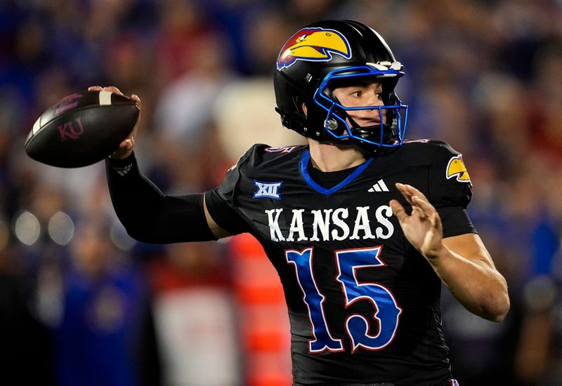 Nov 18, 2023; Lawrence, Kansas, USA; Kansas Jayhawks quarterback Cole Ballard (15) throws a pass during the first half against the Kansas State Wildcats at David Booth Kansas Memorial Stadium. Mandatory Credit: Jay Biggerstaff-USA TODAY Sports