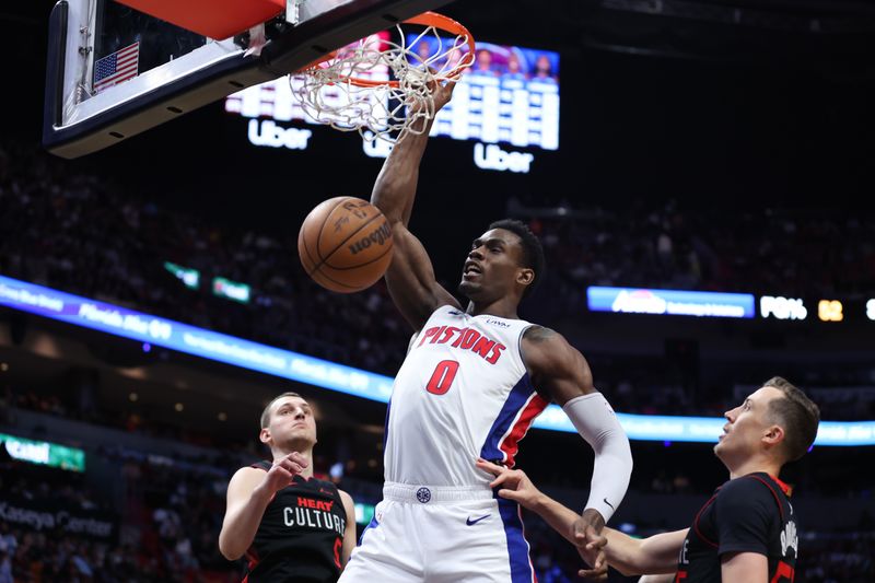 MIAMI, FLORIDA - MARCH 05: Jalen Duren #0 of the Detroit Pistons dunks the ball against Nikola Jovic #5 and Duncan Robinson #55 of the Miami Heat during the third quarter of the game at Kaseya Center on March 05, 2024 in Miami, Florida. NOTE TO USER: User expressly acknowledges and agrees that, by downloading and or using this photograph, User is consenting to the terms and conditions of the Getty Images License Agreement. (Photo by Megan Briggs/Getty Images)