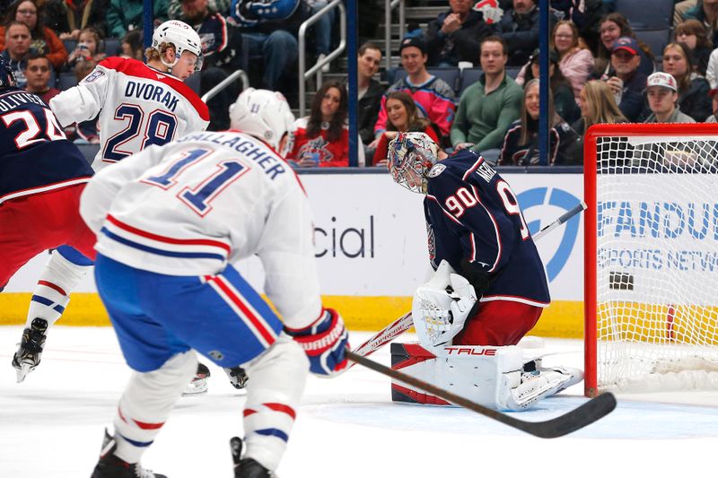 Nov 27, 2024; Columbus, Ohio, USA; Columbus Blue Jackets goalie Elvis Merzlikins (90) makes a save on the shot from Montreal Canadiens center Christian Dvorak (28) during the second period at Nationwide Arena. Mandatory Credit: Russell LaBounty-Imagn Images