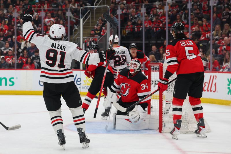 Mar 29, 2026; Newark, New Jersey, USA; Chicago Blackhawks center Frank Nazar (91) celebrates his goal against the New Jersey Devils during the first period at Prudential Center. Mandatory Credit: Ed Mulholland-Imagn Images Mar 29, 2026; Newark, New Jersey, USA; Chicago Blackhawks center Frank Nazar (91) celebrates his goal against the New Jersey Devils during the first period at Prudential Center. Mandatory Credit: Ed Mulholland-Imagn Images