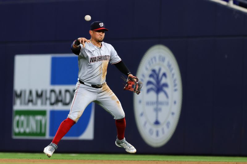 Apr 29, 2024; Miami, Florida, USA; Washington Nationals second baseman Ildemaro Vargas (14) throws to first base to retire Miami Marlins second baseman Luis Arraez (not pictured) during the sixth inning at loanDepot Park. Mandatory Credit: Sam Navarro-USA TODAY Sports