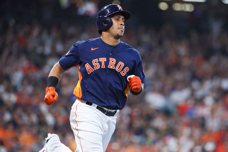 Sep 10, 2023; Houston, Texas, USA; Houston Astros designated hitter Michael Brantley (23) hits a single during the sixth inning against the San Diego Padres at Minute Maid Park. Mandatory Credit: Troy Taormina-USA TODAY Sports