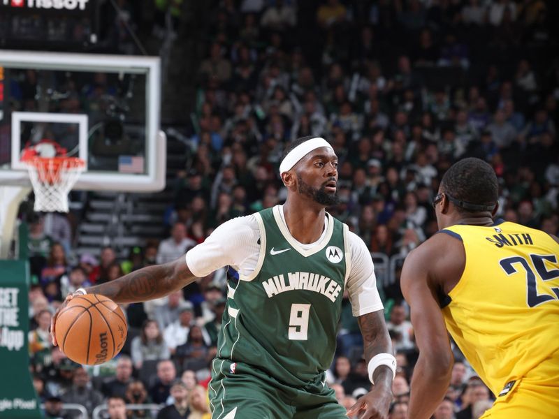 MILWAUKEE, WI - APRIL 21:  Bobby Portis #9 of the Milwaukee Bucks handles the ball during the game  against the Indiana Pacers during Round 1 Game 1 of the 2024 NBA Playoffs  on April 21, 2024 at the Fiserv Forum Center in Milwaukee, Wisconsin. NOTE TO USER: User expressly acknowledges and agrees that, by downloading and or using this Photograph, user is consenting to the terms and conditions of the Getty Images License Agreement. Mandatory Copyright Notice: Copyright 2024 NBAE (Photo by Jeff Haynes/NBAE via Getty Images).