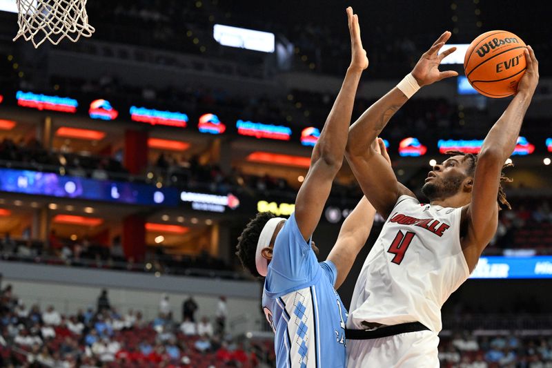 Jan 14, 2023; Louisville, Kentucky, USA;  Louisville Cardinals forward Roosevelt Wheeler (4) shoots against North Carolina Tar Heels forward Jalen Washington (13) during the second half at KFC Yum! Center. North Carolina defeated Louisville 80-59. Mandatory Credit: Jamie Rhodes-USA TODAY Sports