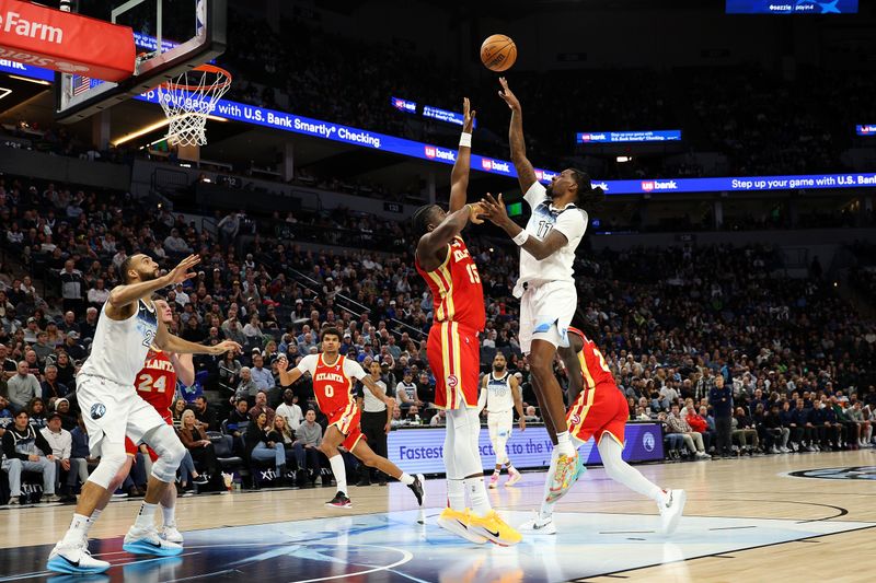 MINNEAPOLIS, MINNESOTA - JANUARY 27: Naz Reid #11 of the Minnesota Timberwolves shoots the ball against Clint Capela #15 of the Atlanta Hawks in the fourth quarter at Target Center on January 27, 2025 in Minneapolis, Minnesota. The Timberwolves defeated the Hawks 100-92. NOTE TO USER: User expressly acknowledges and agrees that, by downloading and or using this photograph, User is consenting to the terms and conditions of the Getty Images License Agreement. (Photo by David Berding/Getty Images)