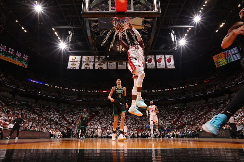 MIAMI, FL - APRIL 27: Bam Adebayo #13 of the Miami Heat dunks the ball during the game against the Boston Celtics during Round 1 Game 3 of the 2024 NBA Playoffs on April 27, 2024 at Kaseya Center in Miami, Florida. NOTE TO USER: User expressly acknowledges and agrees that, by downloading and or using this Photograph, user is consenting to the terms and conditions of the Getty Images License Agreement. Mandatory Copyright Notice: Copyright 2024 NBAE (Photo by Issac Baldizon/NBAE via Getty Images)