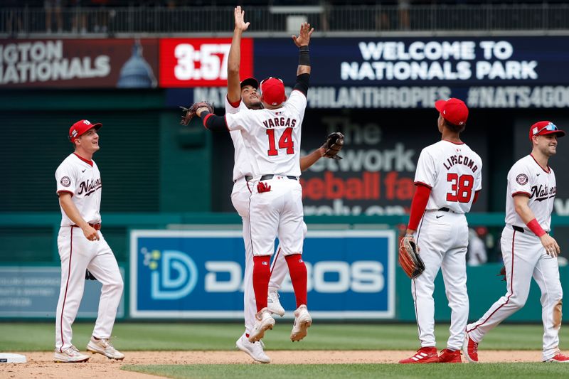 Jul 21, 2024; Washington, District of Columbia, USA; Washington Nationals outfielder James Wood (29) celebrates with Nationals second base Ildemaro Vargas (14) after their game against the Cincinnati Reds at Nationals Park. Mandatory Credit: Geoff Burke-USA TODAY Sports