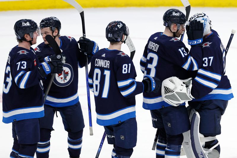 Apr 21, 2024; Winnipeg, Manitoba, CAN; Winnipeg Jets celebrate their victory over the Colorado Avalanche in game one of the first round of the 2024 Stanley Cup Playoffs at Canada Life Centre. Mandatory Credit: James Carey Lauder-USA TODAY Sports