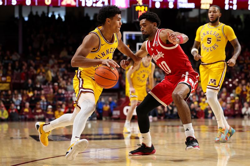 Jan 24, 2026; Minneapolis, Minnesota, USA; Minnesota Golden Gophers guard Isaac Asuma (1) works around Nebraska Cornhuskers guard Jamarques Lawrence (10) during the first half at Williams Arena. Mandatory Credit: Matt Krohn-Imagn Images