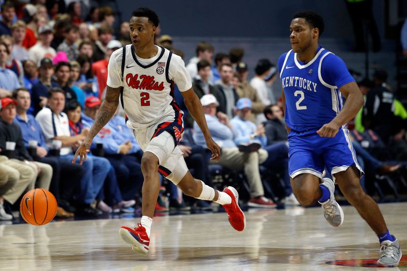 Jan 31, 2023; Oxford, Mississippi, USA; Mississippi Rebels guard TJ Caldwell (2) dribbles the ball up the court as Kentucky Wildcats guard Sahvir Wheeler (2) persues during the second half at The Sandy and John Black Pavilion at Ole Miss. Mandatory Credit: Petre Thomas-USA TODAY Sports