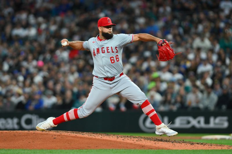 May 31, 2024; Seattle, Washington, USA; Los Angeles Angels relief pitcher Luis Garcia (66) pitches to the Seattle Mariners during the seventh inning at T-Mobile Park. Mandatory Credit: Steven Bisig-USA TODAY Sports