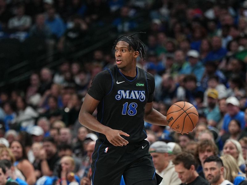 DALLAS, TX - APRIL 12: Olivier Maxence-Prosper #18 of the Dallas Mavericks dribbles the ball during the game against the Detroit Pistons on April 12, 2024 at the American Airlines Center in Dallas, Texas. NOTE TO USER: User expressly acknowledges and agrees that, by downloading and or using this photograph, User is consenting to the terms and conditions of the Getty Images License Agreement. Mandatory Copyright Notice: Copyright 2024 NBAE (Photo by Glenn James/NBAE via Getty Images)