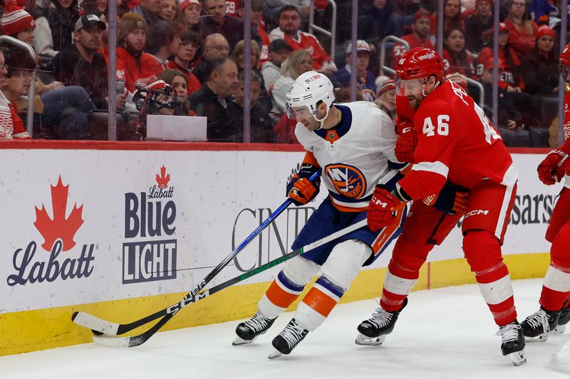 Feb 29, 2024; Detroit, Michigan, USA;  New York Islanders center Kyle Palmieri (21) and Detroit Red Wings defenseman Jeff Petry (46) battle for the puck in the first period at Little Caesars Arena. Mandatory Credit: Rick Osentoski-USA TODAY Sports