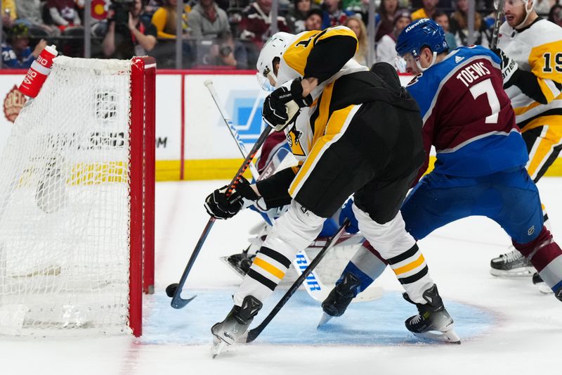 Mar 24, 2024; Denver, Colorado, USA; Pittsburgh Penguins right wing Jesse Puljujarvi (18) scores past Colorado Avalanche defenseman Devon Toews (7) in the first period at Ball Arena. Mandatory Credit: Ron Chenoy-USA TODAY Sports