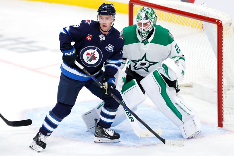 Oct 9, 2025; Winnipeg, Manitoba, CAN; Winnipeg Jets centre Jonathan Toews looks for a shot in front of Dallas Stars goaltender Jake Oettinger (29) in the second period at Canada Life Centre. Mandatory Credit: James Carey Lauder-Imagn Images