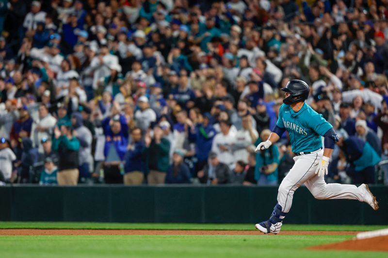 Apr 14, 2023; Seattle, Washington, USA; Seattle Mariners first baseman Ty France (23) advances to second base for a two-run double against the Colorado Rockies during the fourth inning at T-Mobile Park. Mandatory Credit: Joe Nicholson-USA TODAY Sports