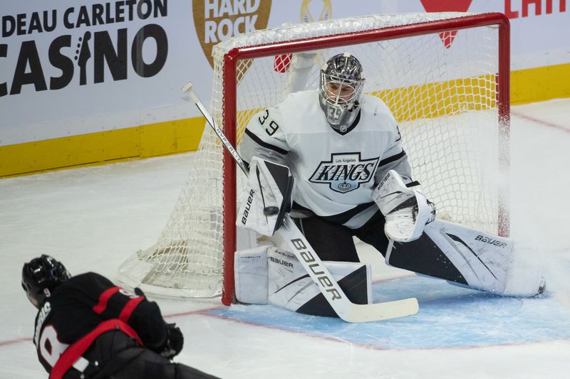 Nov 2, 2023; Ottawa, Ontario, CAN; Los Angeles Kings goalie Cam Talbot (39) makes a save on a shot from Ottawa Senators center Josh Norris (9) in the third period at the Canadian Tire Centre. Mandatory Credit: Marc DesRosiers-USA TODAY Sports