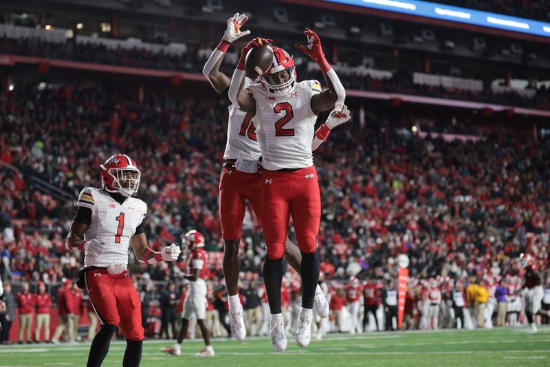 Nov 25, 2023; Piscataway, New Jersey, USA; Maryland Terrapins tight end Corey Dyches (2) celebrates his touchdown reception with teammates during the first half against the Rutgers Scarlet Knights at SHI Stadium. Mandatory Credit: Vincent Carchietta-USA TODAY Sports