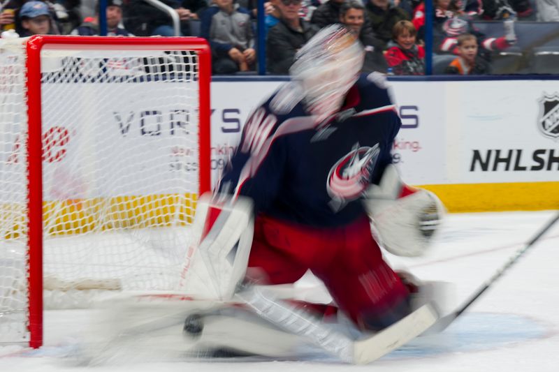 Nov 2, 2023; Columbus, Ohio, USA;  Columbus Blue Jackets goaltender Elvis Merzlikins (90) makes a save in net against the Tampa Bay Lightning in the second period at Nationwide Arena. Mandatory Credit: Aaron Doster-USA TODAY Sports