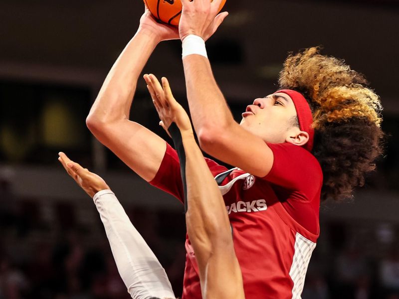 Feb 4, 2023; Columbia, South Carolina, USA; Arkansas Razorbacks guard Anthony Black (0) shoots over South Carolina Gamecocks guard Meechie Johnson (5) in the second half at Colonial Life Arena. Mandatory Credit: Jeff Blake-USA TODAY Sports