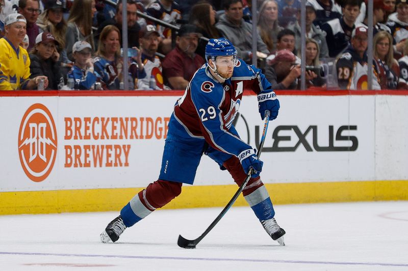 May 11, 2024; Denver, Colorado, USA; Colorado Avalanche center Nathan MacKinnon (29) passes the puck in the third period against the Dallas Stars in game three of the second round of the 2024 Stanley Cup Playoffs at Ball Arena. Mandatory Credit: Isaiah J. Downing-USA TODAY Sports