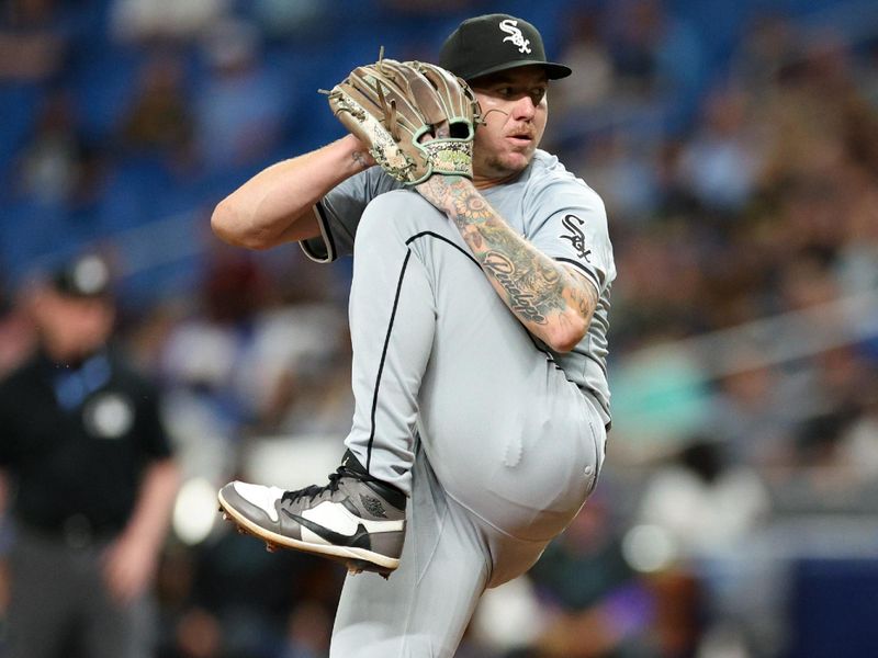 May 6, 2024; St. Petersburg, Florida, USA;  Chicago White Sox pitcher Mike Cleavinger (52) throws a pitch against the Tampa Bay Rays in the first inning at Tropicana Field. Mandatory Credit: Nathan Ray Seebeck-USA TODAY Sports