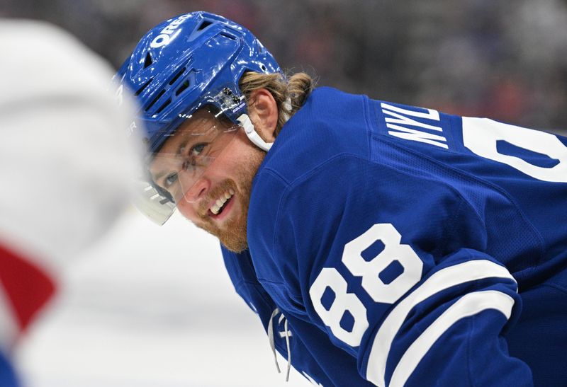 Sep 26, 2024; Toronto, Ontario, CAN;  Toronto Maple Leafs forward William Nylander (88) reacts to a remark from a Montreal Canadiens player as they await a faceoff in the first period at Scotiabank Arena. Mandatory Credit: Dan Hamilton-Imagn Images