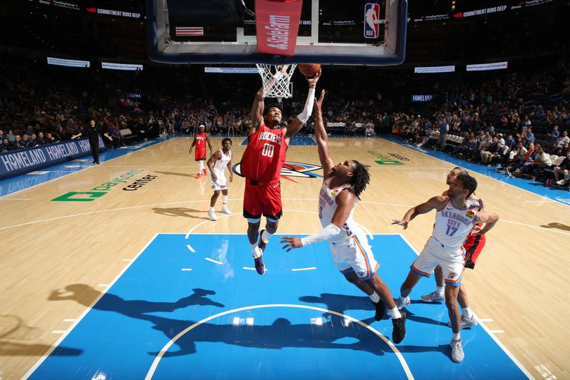 OKLAHOMA CITY, OK - OCTOBER 9: Jermaine Samuels Jr. #00 of the Houston Rockets dunks the ball during the game against the Oklahoma City Thunder during a NBA pre season game on October 9, 2024 at Paycom Center in Oklahoma City, Oklahoma. NOTE TO USER: User expressly acknowledges and agrees that, by downloading and or using this photograph, User is consenting to the terms and conditions of the Getty Images License Agreement. Mandatory Copyright Notice: Copyright 2024 NBAE (Photo by Zach Beeker/NBAE via Getty Images)