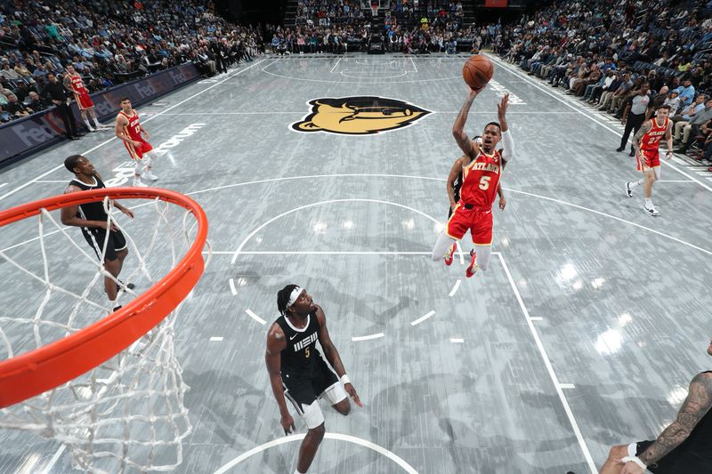 MEMPHIS, TN - MARCH 8: Dejounte Murray #5 of the Atlanta Hawks shoots the ball during the game against the Memphis Grizzlies on March 8, 2024 at FedExForum in Memphis, Tennessee. NOTE TO USER: User expressly acknowledges and agrees that, by downloading and or using this photograph, User is consenting to the terms and conditions of the Getty Images License Agreement. Mandatory Copyright Notice: Copyright 2024 NBAE (Photo by Joe Murphy/NBAE via Getty Images)