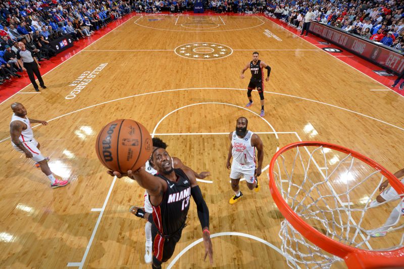 PHILADELPHIA, PA - APRIL 6: Bam Adebayo #13 of the Miami Heat drives to the basket during the game against the Philadelphia 76ers on April 6, 2023 at the Wells Fargo Center in Philadelphia, Pennsylvania NOTE TO USER: User expressly acknowledges and agrees that, by downloading and/or using this Photograph, user is consenting to the terms and conditions of the Getty Images License Agreement. Mandatory Copyright Notice: Copyright 2023 NBAE (Photo by Jesse D. Garrabrant/NBAE via Getty Images)