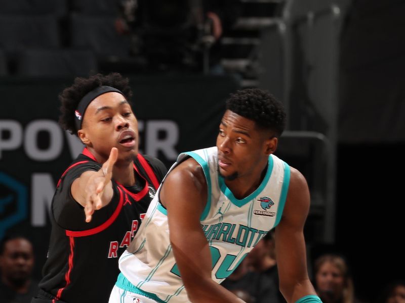 CHARLOTTE, NC - JANUARY 1: Brandon Miller #24 of the Charlotte Hornets handles the ball during the game against the Toronto Raptors on January 1, 2024 at Spectrum Center in Charlotte, North Carolina. NOTE TO USER: User expressly acknowledges and agrees that, by downloading and or using this photograph, User is consenting to the terms and conditions of the Getty Images License Agreement. Mandatory Copyright Notice: Copyright 2024 NBAE (Photo by Kent Smith/NBAE via Getty Images)