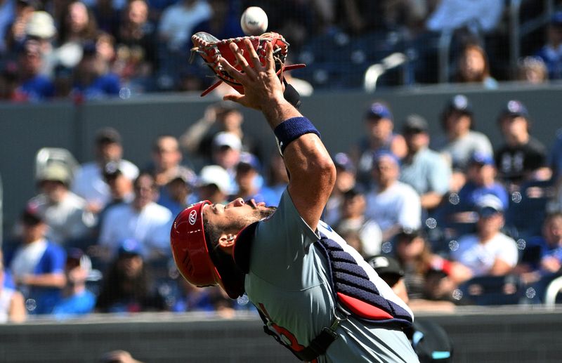 Sep 15, 2024; Toronto, Ontario, CAN;  St. Louis Cardinals catcher Ivan Herrera (48) catches a pop up hit by Toronto Blue Jays designated hitter Vladimir Guerrero Jr. (not shown in the first inning at Rogers Centre. Mandatory Credit: Dan Hamilton-Imagn Images