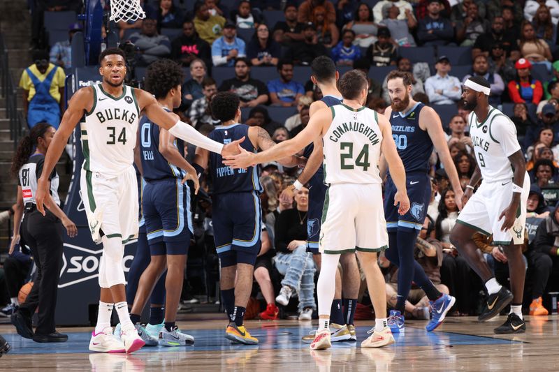 MEMPHIS, TN - OCTOBER 31: Giannis Antetokounmpo #34 and Pat Connaughton #24 of the Milwaukee Bucks high five during the game against the Memphis Grizzlies on October 31, 2024 at FedExForum in Memphis, Tennessee. NOTE TO USER: User expressly acknowledges and agrees that, by downloading and or using this photograph, User is consenting to the terms and conditions of the Getty Images License Agreement. Mandatory Copyright Notice: Copyright 2024 NBAE (Photo by Joe Murphy/NBAE via Getty Images)