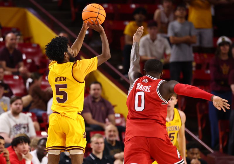 Feb 28, 2026; Tempe, Arizona, USA; Arizona State Sun Devils guard Maurice Odum (5) shoots a three pointer against the Utah Utes in the first half at Desert Financial Arena. Mandatory Credit: Mark J. Rebilas-Imagn Images