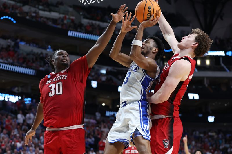 Mar 31, 2024; Dallas, TX, USA; Duke Blue Devils guard Jeremy Roach (3) shoots against North Carolina State Wolfpack forward DJ Burns Jr. (30) and forward Ben Middlebrooks (34) in the second half in the finals of the South Regional of the 2024 NCAA Tournament at American Airline Center. Mandatory Credit: Tim Heitman-USA TODAY Sports