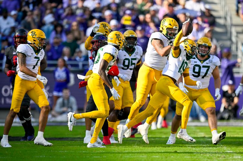 Nov 18, 2023; Fort Worth, Texas, USA; Baylor Bears cornerback Caden Jenkins (19) celebrates with the Bears defense after recovering a TCU Horned Frogs fumble during the first half at Amon G. Carter Stadium. Mandatory Credit: Jerome Miron-USA TODAY Sports