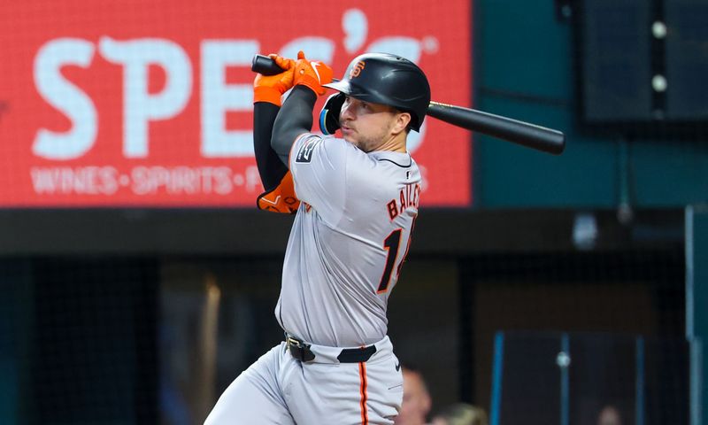 Jun 9, 2024; Arlington, Texas, USA; San Francisco Giants catcher Patrick Bailey (14) hits an rbi single during the third inning against the Texas Rangers at Globe Life Field. Mandatory Credit: Kevin Jairaj-USA TODAY Sports