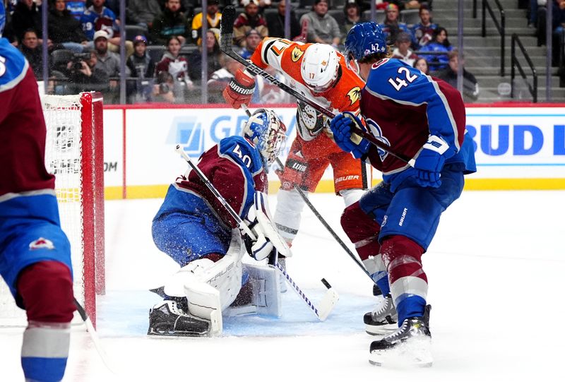 Oct 18, 2024; Denver, Colorado, USA; Anaheim Ducks left wing Alex Killorn (17) attempts to score past Colorado Avalanche goaltender Alexandar Georgiev (40) and defenseman Josh Manson (42) in the first period at Ball Arena. Mandatory Credit: Ron Chenoy-Imagn Images