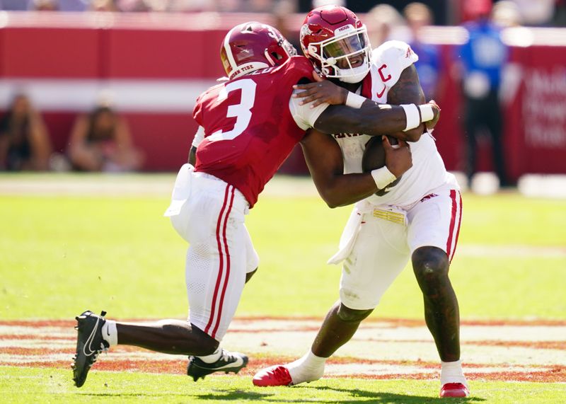 Oct 14, 2023; Tuscaloosa, Alabama, USA; Arkansas Razorbacks quarterback KJ Jefferson (1) shakes off Alabama Crimson Tide defensive back Terrion Arnold (3)  during the fourth quarter against the Alabama Crimson Tide at Bryant-Denny Stadium. Mandatory Credit: John David Mercer-USA TODAY Sports