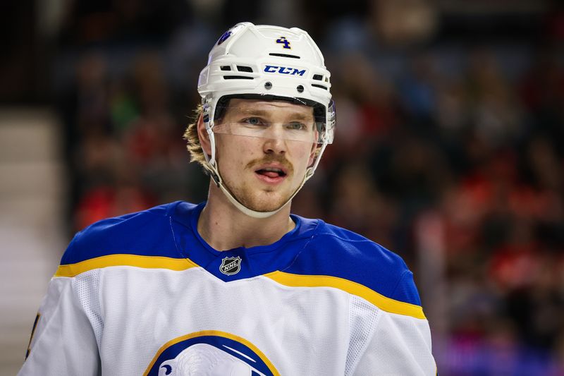 Jan 23, 2025; Calgary, Alberta, CAN; Buffalo Sabres defenseman Bowen Byram (4) against the Calgary Flames during the second period at Scotiabank Saddledome. Mandatory Credit: Sergei Belski-Imagn Images