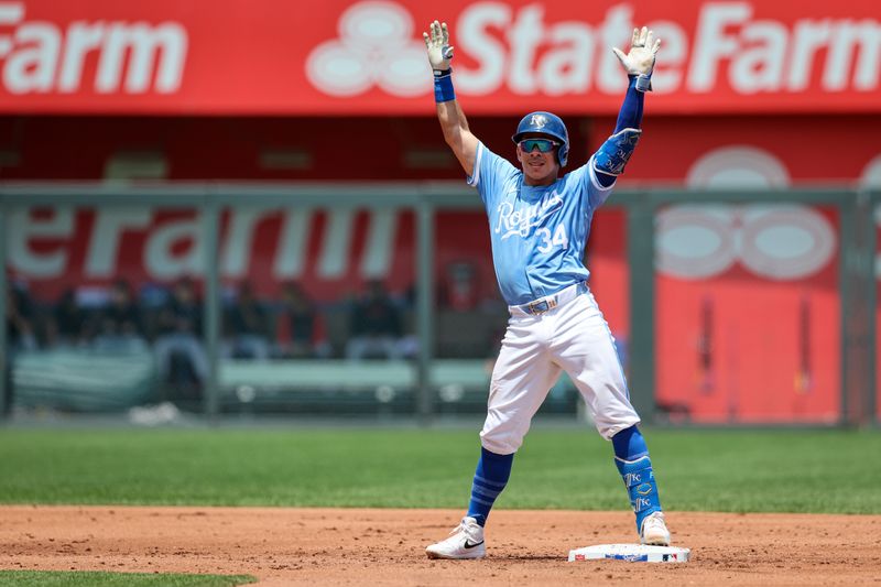 Jun 30, 2024; Kansas City, Missouri, USA; Kansas City Royals catcher Freddy Fermin (34) reacts on second base after hitting a double during the second inning against the Cleveland Guardians at Kauffman Stadium. Mandatory Credit: William Purnell-USA TODAY Sports