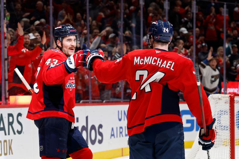 Nov 19, 2025; Washington, District of Columbia, USA; Washington Capitals right wing Tom Wilson (43) celebrates with Capitals center Connor McMichael (24) after scoring an empty-net goal against the Edmonton Oilers during the third period at Capital One Arena. Mandatory Credit: Geoff Burke-Imagn Images