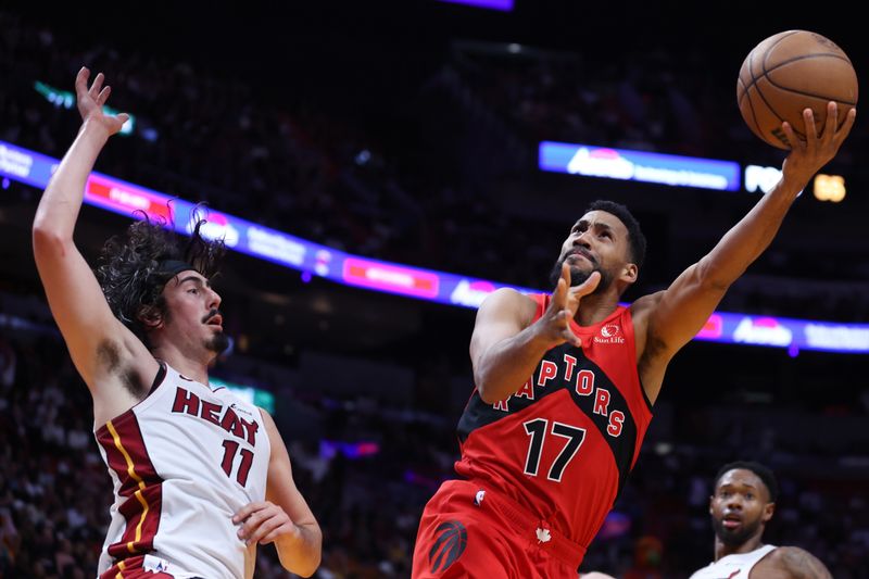 MIAMI, FLORIDA - APRIL 12: Garrett Temple #17 of the Toronto Raptors drives to the basket against Jaime Jaquez Jr. #11 of the Miami Heat during the fourth quarter of the game at Kaseya Center on April 12, 2024 in Miami, Florida. NOTE TO USER: User expressly acknowledges and agrees that, by downloading and or using this photograph, User is consenting to the terms and conditions of the Getty Images License Agreement. (Photo by Megan Briggs/Getty Images)